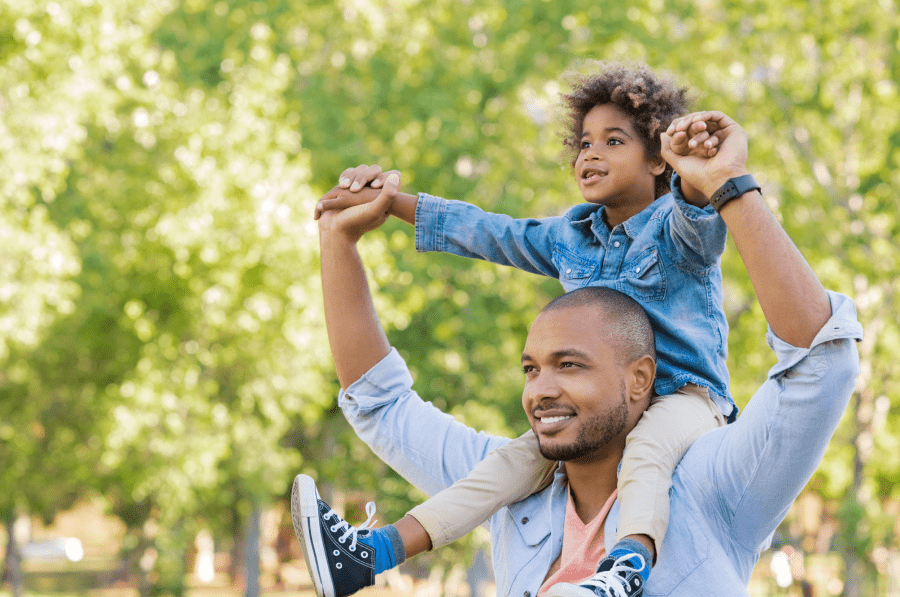 Man with a child on the shoulders